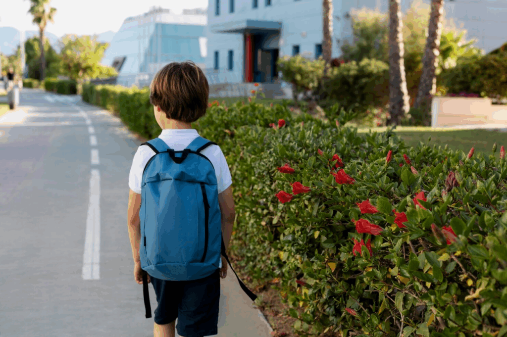 A student properly wearing a backpack to prevent back pain.