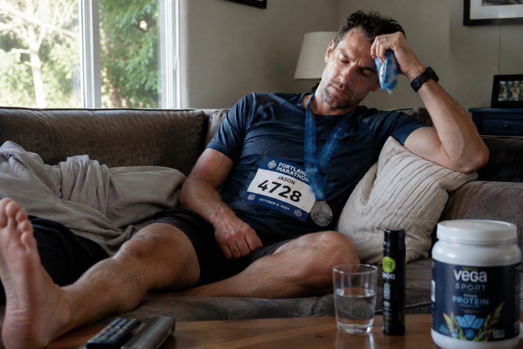 Marathon runner recovering at home after a race. 